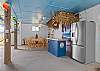 The garage has three door you can open to allow the breeze to cool you off, their is a Tiki bar, a game table, and a full size refrigerator, 