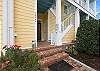 The ground floor door goes to Beau-tique Cottage, a separate condo