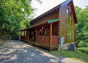Pigeon Forge Log Cabin near Parkway with Arcade, Pool access, & Pool Table