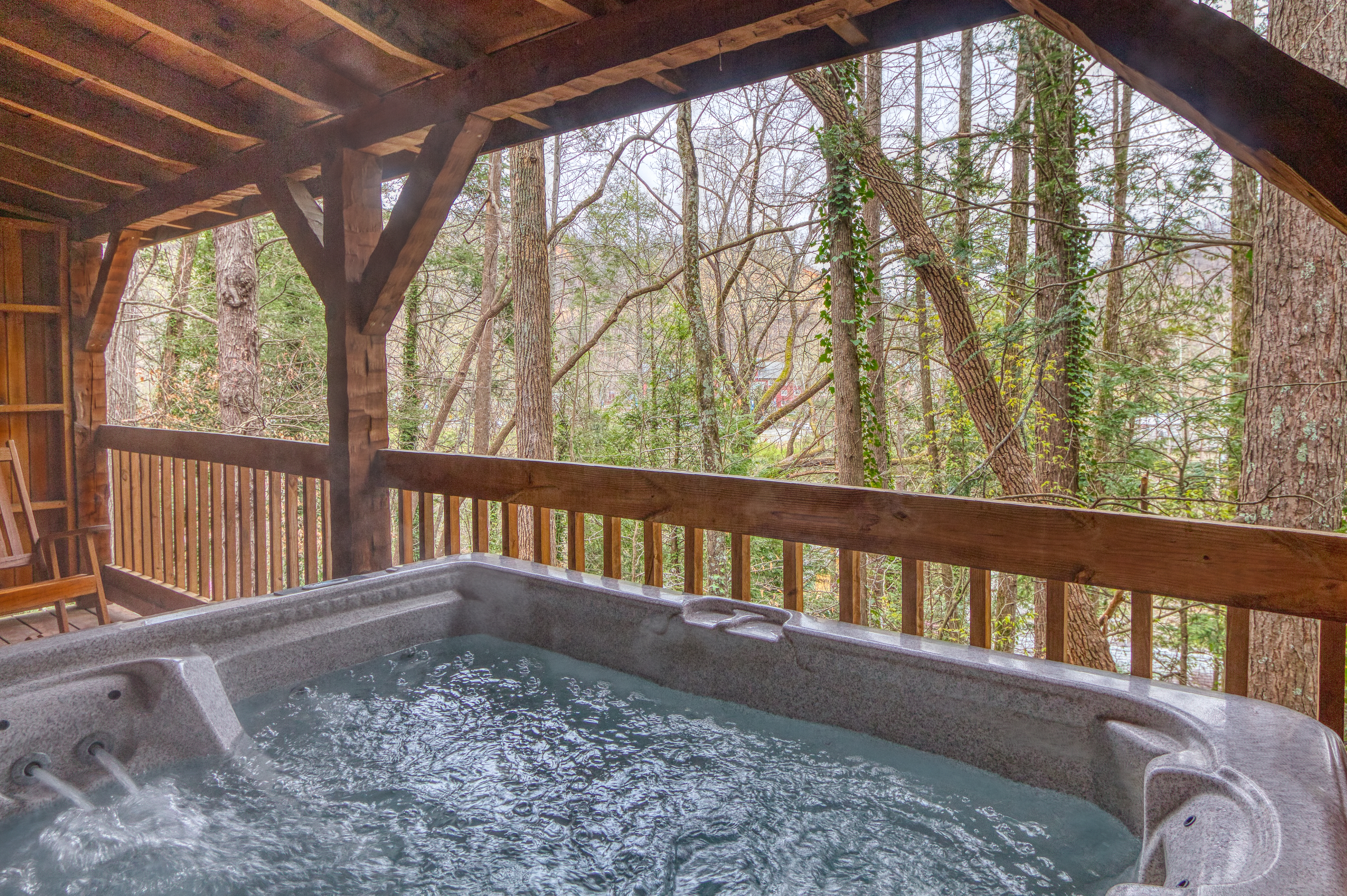 Covered hot tub with river sounds in Gatlinburg, Tennessee. Reserve today!