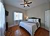 The third bedroom is on the first level and has a king bed, tv, and attached bathroom.
