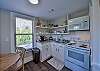 The kitchen is fully stocked to cook meals. There is also a coffee maker.