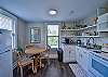 There is a small dining table to enjoy your home cooked meal at.