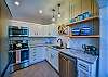 The kitchen is fully equipped to make a home cooked meal.