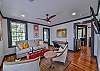The living room upstairs has plenty of comfy seating as well as a smart tv.