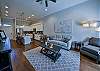 The living room has seating for you and your group to gather in and watch the Alabama game on the smart tv.