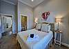 The second bedroom has a queen bed and attached bathroom.