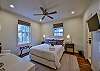 The first bedroom is located on the first floor and has a queen bed and shares a jack-and-jill bathroom with the second bedroom.