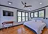The second bedroom has a king bed, desk space, and tv.