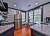The kitchen is fully equipped with everything you need to craft tailgate snacks or a home cooked meal.