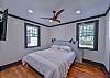 The second bedroom has a king bed, tv, and attached bathroom.