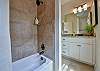 The second bathroom has a tub-shower.
