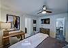 The first bedroom has a king bed and desk as well as the attached bathroom.