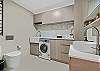 Washing machine, dryer, shower, toilet and vanity. 