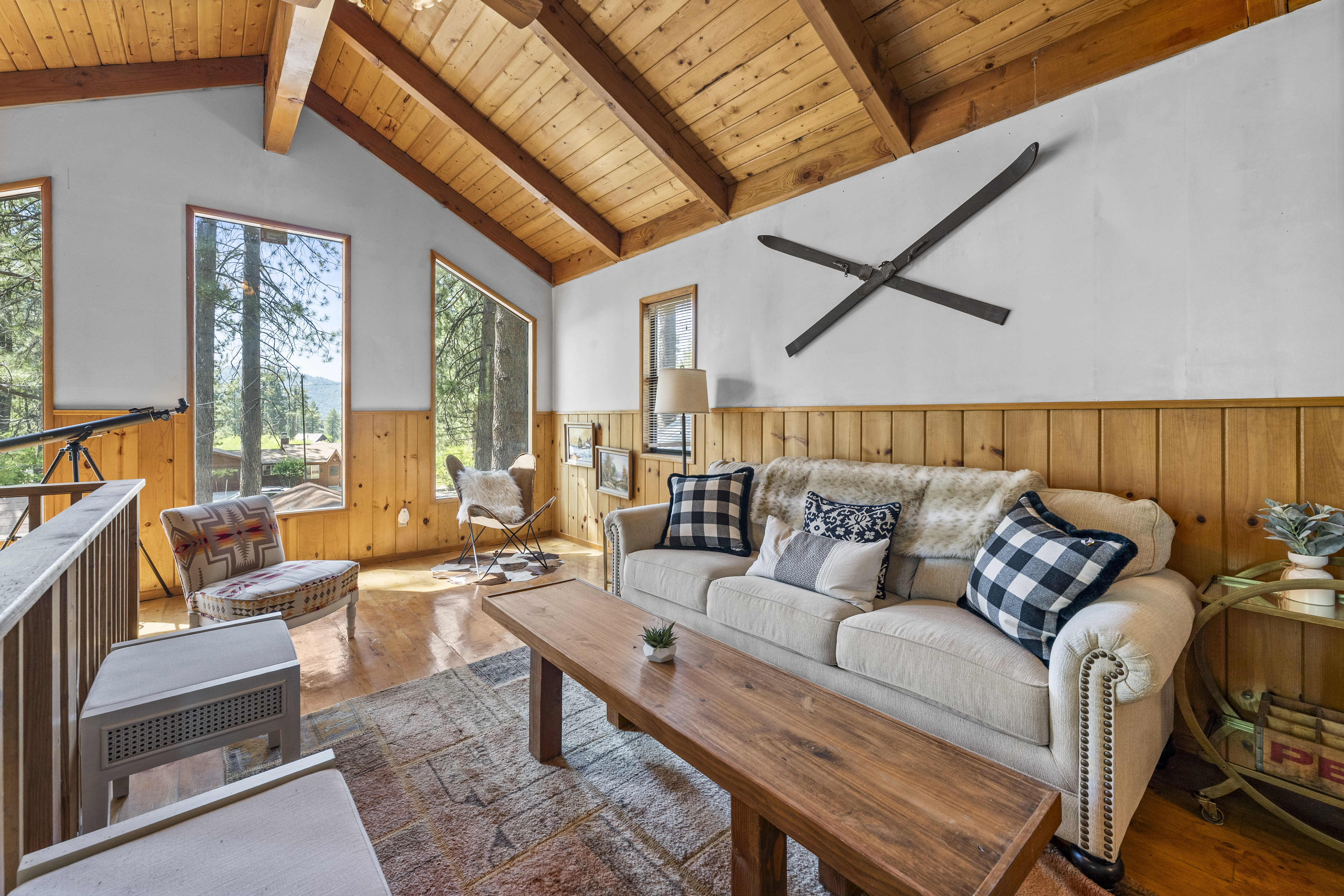 Upstairs Living Room with beautiful windows looking out on peekaboo lake views