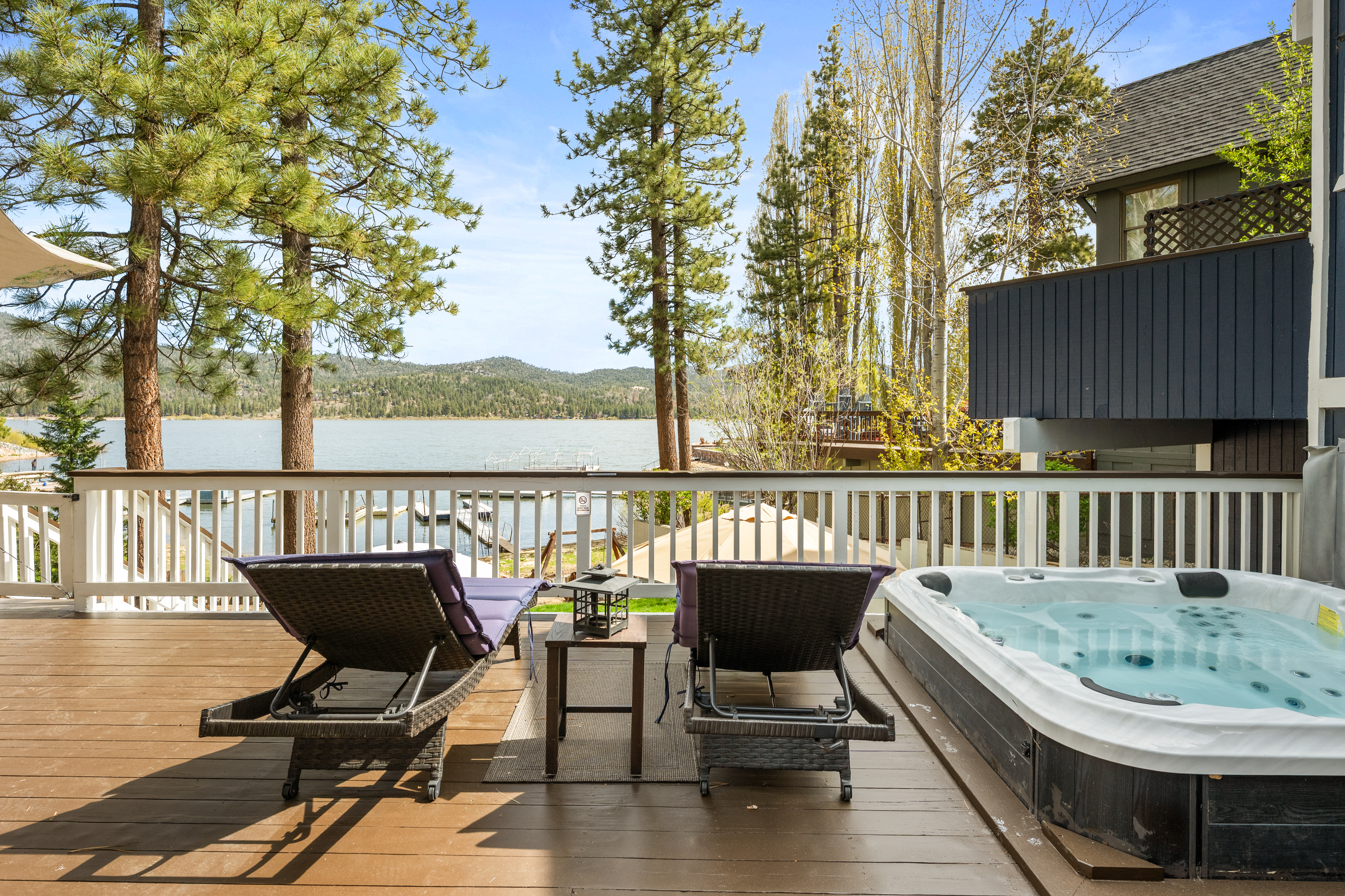 Private outdoor deck with hot tub, seating, BBQ, and Lake Views
