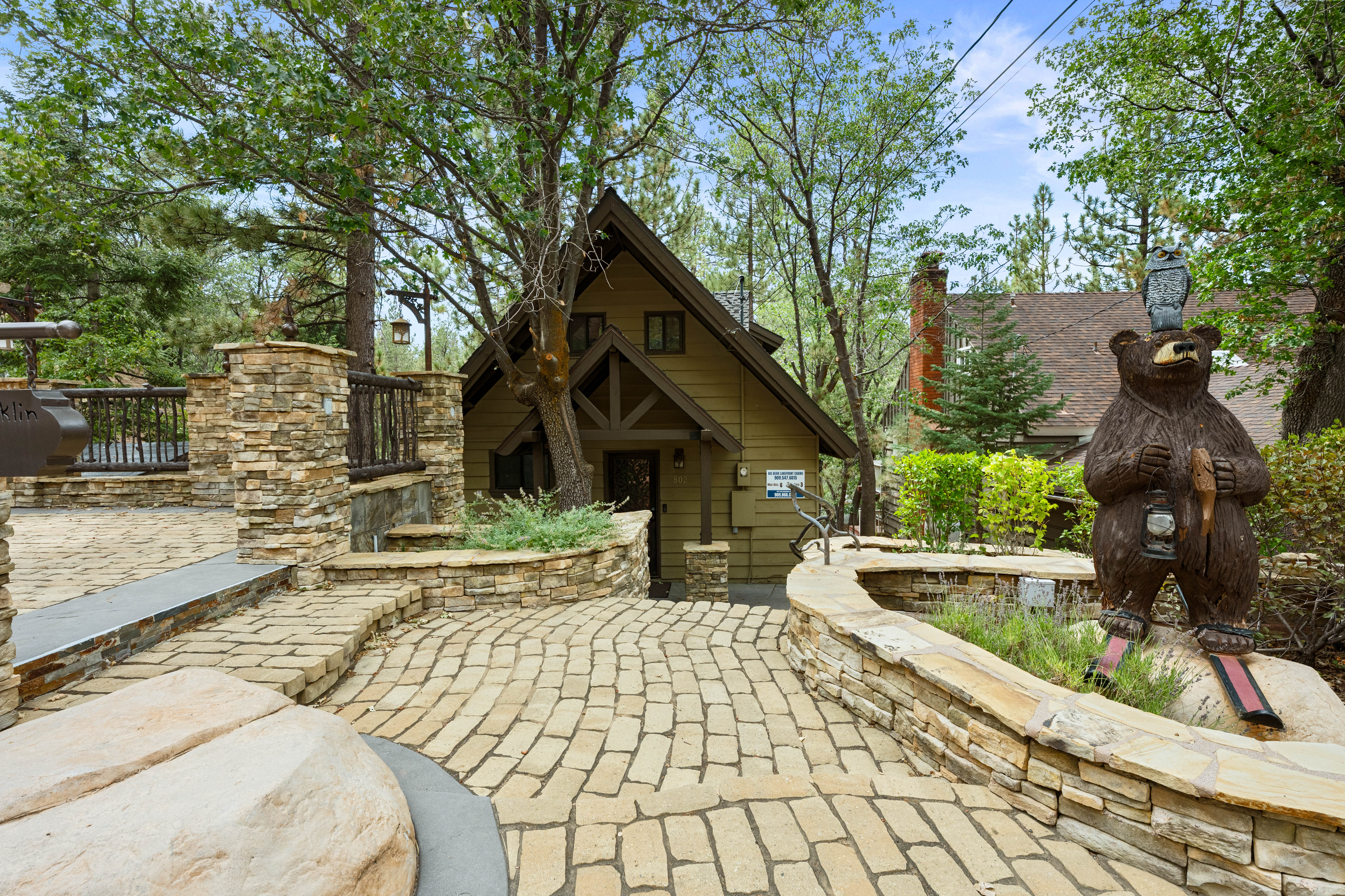 Adorable Front of House with bear and custom built driveway