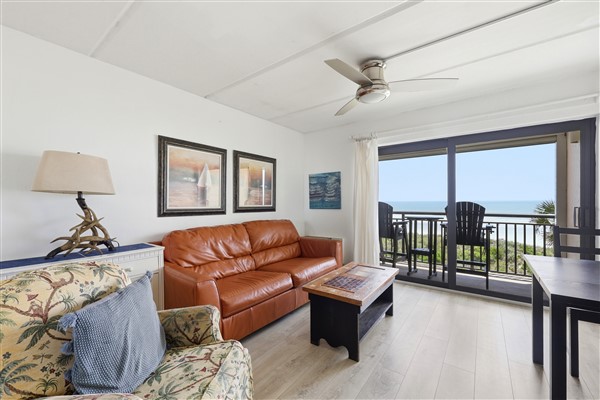 Balcony Suite With Leather Sofa And Kitchen Amenities - Charming Coastal Retreat - Crescent Beach, FL
