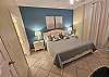 Master Bedroom with beautiful accent wall. 