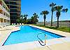 Beautiful Pool Area complete with Pool Chairs and Palm Trees!