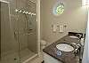 King Master attached bath with double vanity and walk in shower.
