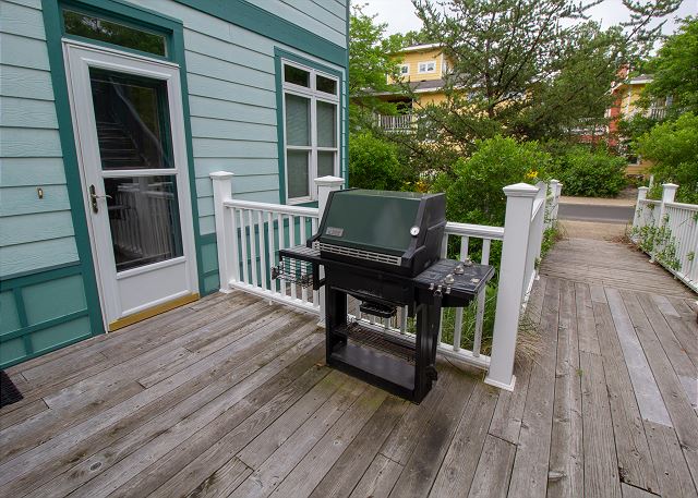 Gas grill on back porch 