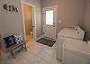 Off the kitchen is the laundry room with a half bath Off the kitchen is the laundry room with a half bath