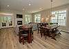 Main level open living room and dining with a double sided gas f Main level open living room and dining with a double sided gas f