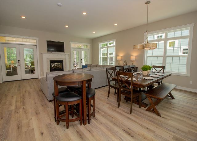 Main level open living room and dining with a double sided gas f Main level open living room and dining with a double sided gas f