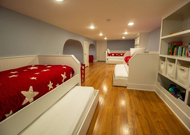 Basement  with three twin beds with trundles 