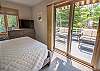 Main level bedroom #1 - queen bed with private deck Main level bedroom #1 - queen bed with private deck