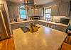 Main level full kitchen with deck access Main level full kitchen with deck access