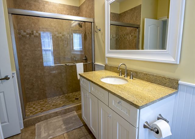 Main Level | Bedroom 1 | Attached Bath with Walk in Shower 