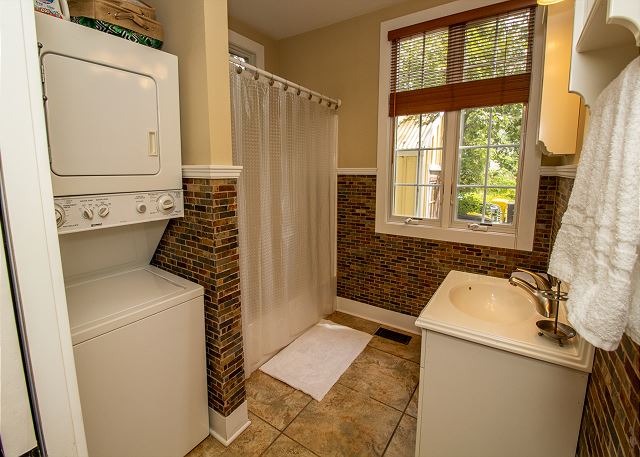 Main level full master bath with stackingg washer and dryer