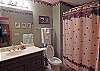 Lower Level Hall Bath with combination Tub/Shower is shared by Twin Bedroom and Bunk Bedroom