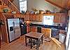 Kitchen - Access to Upper Deck and open floor plan to Dining Area and Great Room