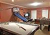 Game Room with Pool Table, Foosball, Basketball, TV, DVD, Wii game and sleeper-sofa.