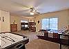 Large Ground Level Bedroom has 1 Queen Bed and 4 Twin Bunk Beds, Air Hockey Game.  Jack-N-Jill Bath with combination tub/shower is shared with the adjacent Game Room