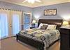 Upper Level Master Suite with King Bed, its own Deck and private Bath with soaking tub and walk-in shower