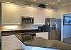Kitchen features granite counter tops and new Stainless Steel appliances