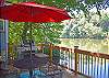 Deck has table, 4 chairs, sun umbrella, gas grill
