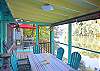 Screened Porch and Deck overlooking the lake.  Dining table for 6 in the porch, additional table and 4 chairs on the deck.  Gas Grill.