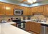 Kitchen is bright and functional with newer stainless steel appliances