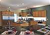 Kitchen is a dream for home cooks preparing for large gatherings.  Extra-Large capacity refrigerator and freezer, separate wine refrig, 2 sinks.