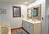 Newly updated Master Bath has Double Vanity, Soaking Tub and separate Shower, plank flooring