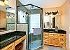 Bright and Sunny Walk In Shower and Two Vanities in this Spacious Bathroom