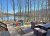 Welcome to Serenity Cove - A peaceful mountain lakefront home in Rumbling Bald.  Wonderful outdoor spaces include private dock and watercraft, fire pit area, outdoor seating...