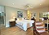 King bed with sitting area with balcony overlooking Lake Lure
 