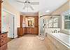 Primary Bedroom Private Bath with soaking tub, step-in shower, 2 sink areas, private toilet room.