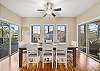 Dining Area - table for 8, access to Main Level Deck, Hot Tub on left, and Screened Porch with Gas Fireplace on right.